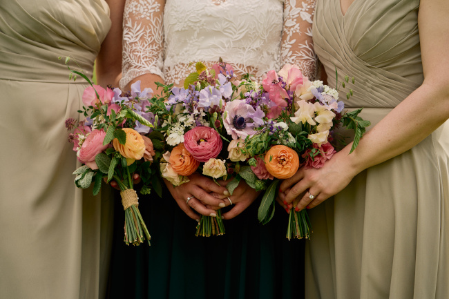 Bride and bridesmaids holding bouquets