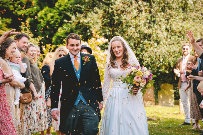 Bride and bridesmaids holding bouquets